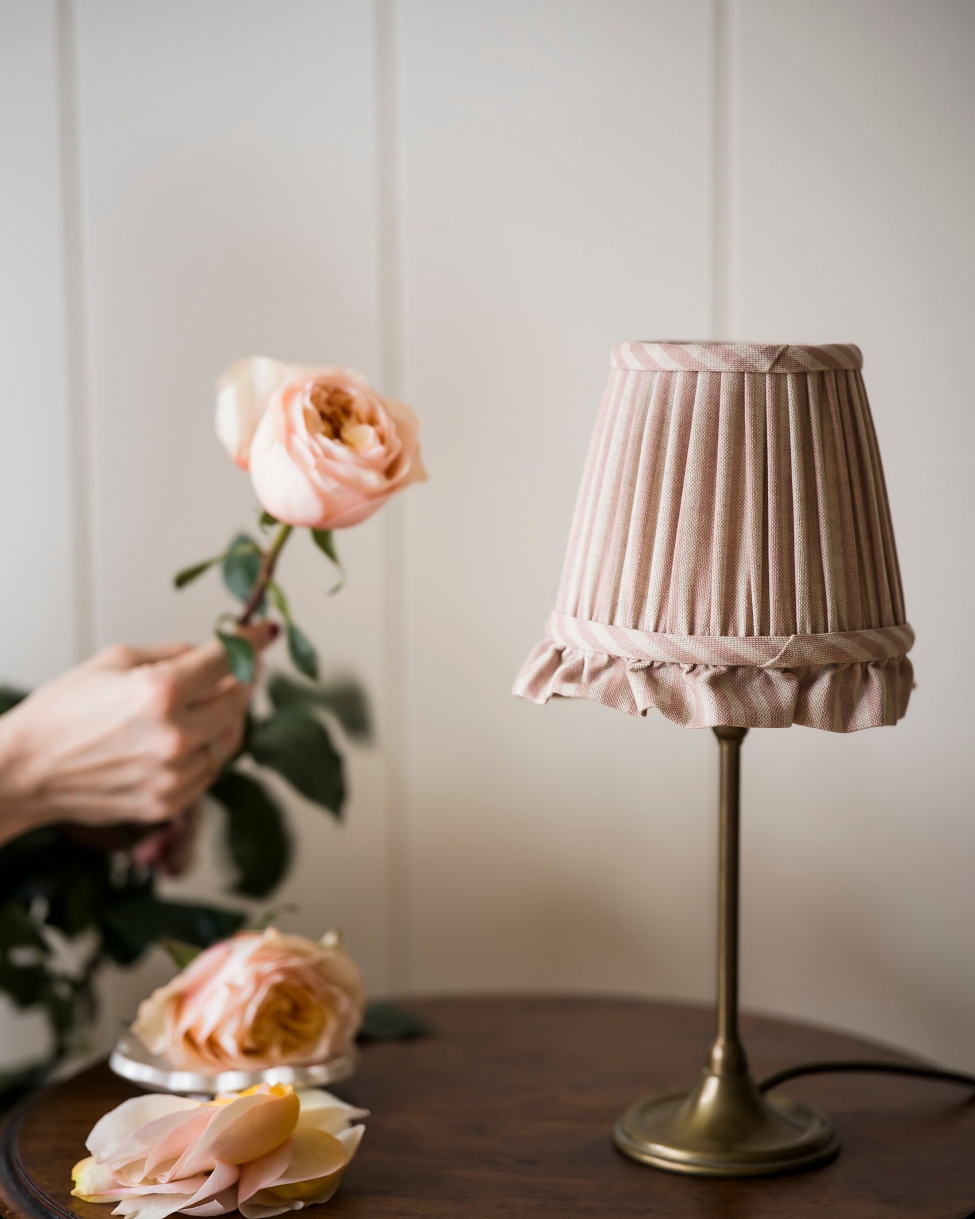 Frilled lampshade in old rose on gold lampstand
