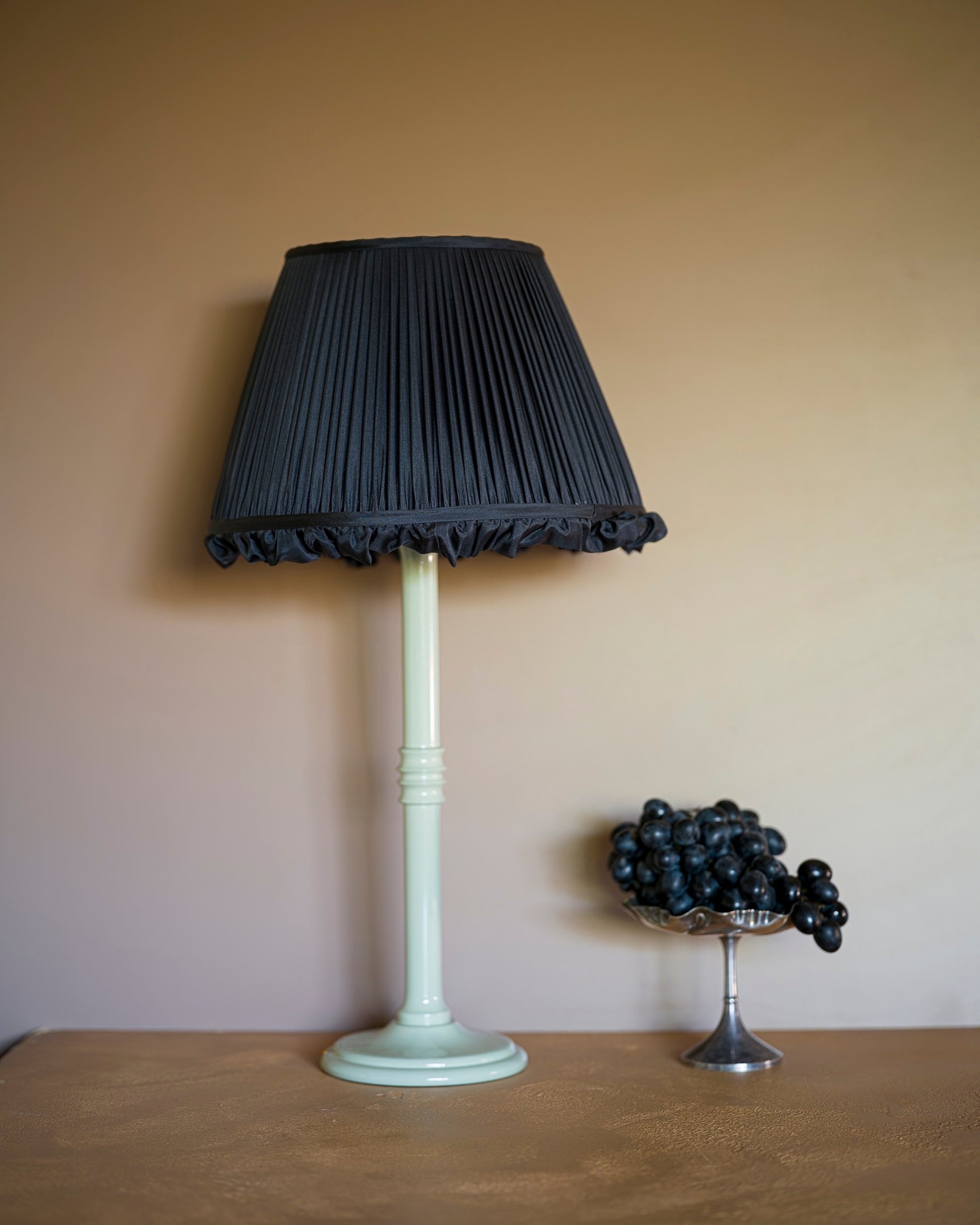 Frilly lampshade in black grape on lampstand