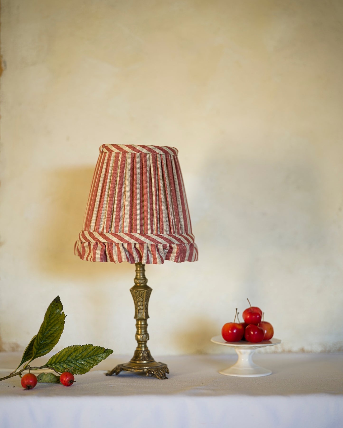 Luxury frilled lampshade in crabapple on lampstand