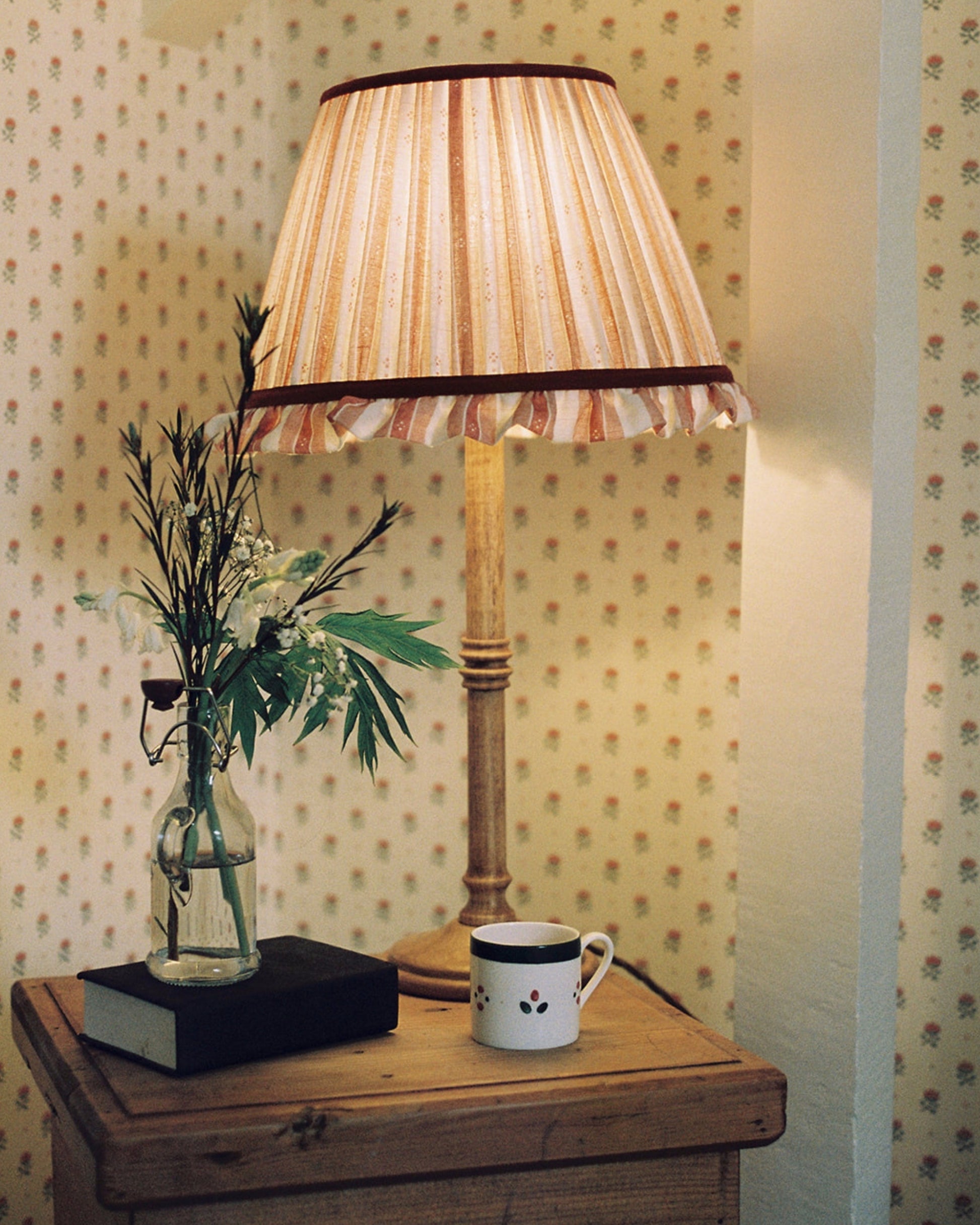 Luxury frilled lampshade in pink on drawers