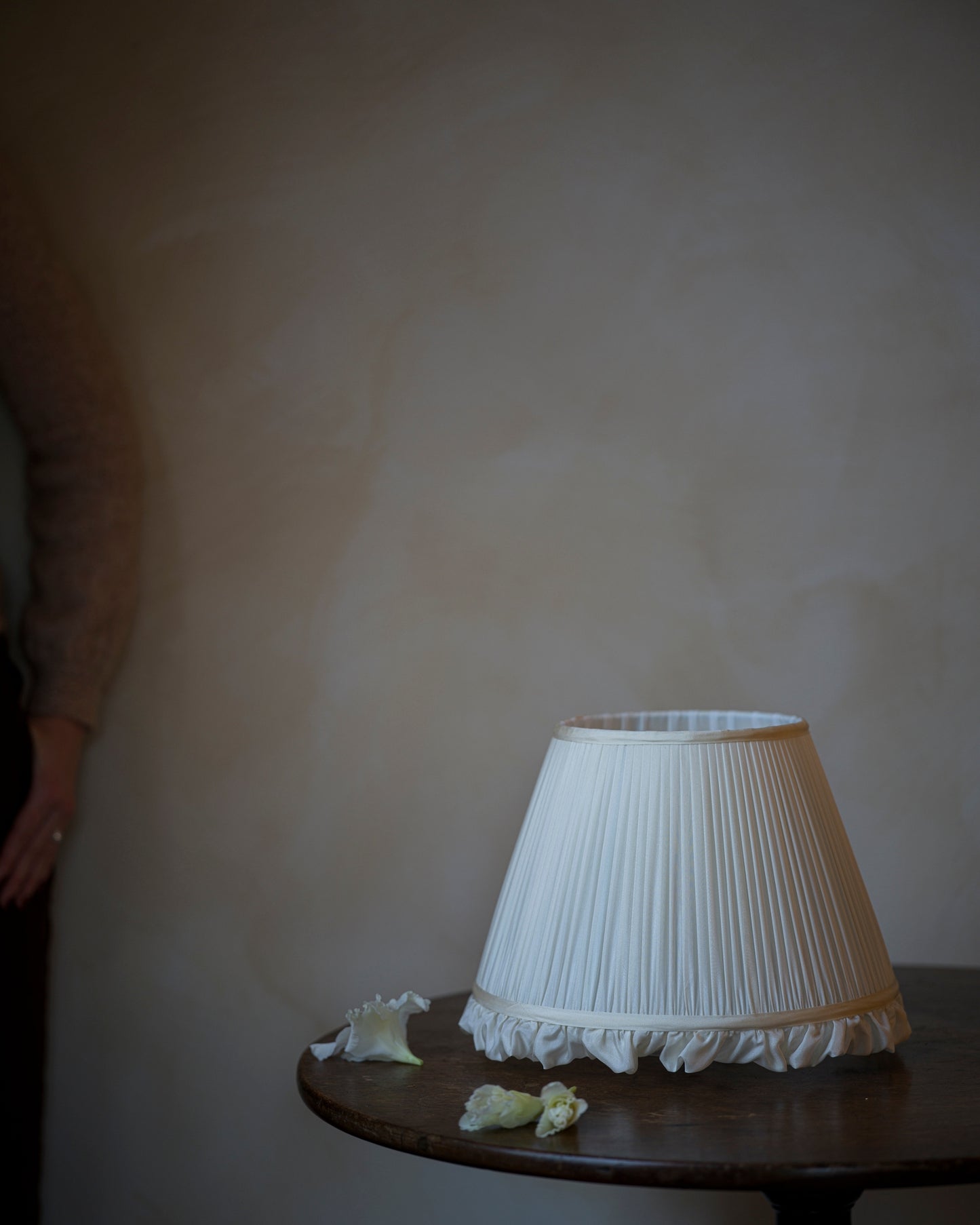 Luxury frilly lampshade in iris on table