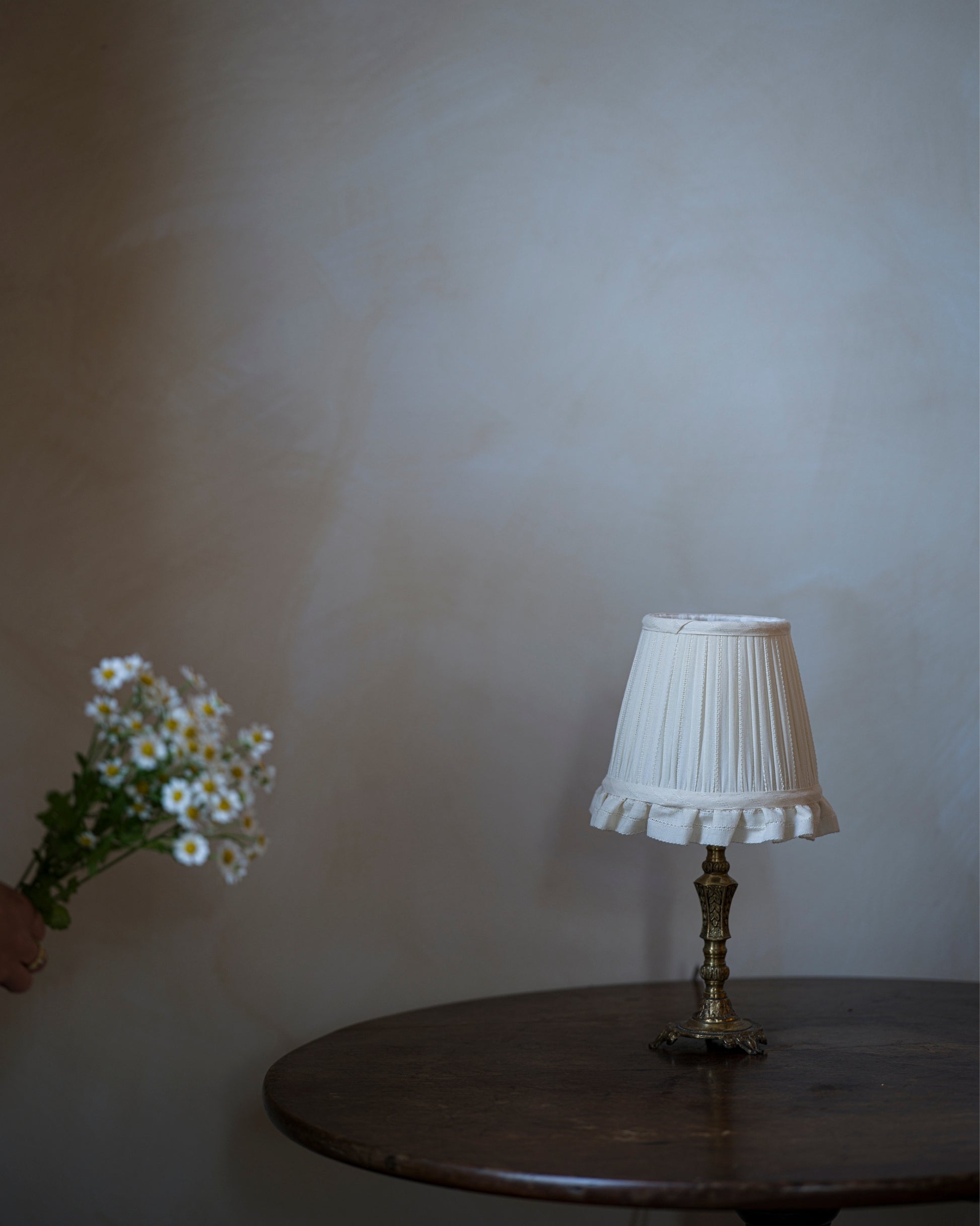 Embroidered wall light lampshade in daisy on lampstand