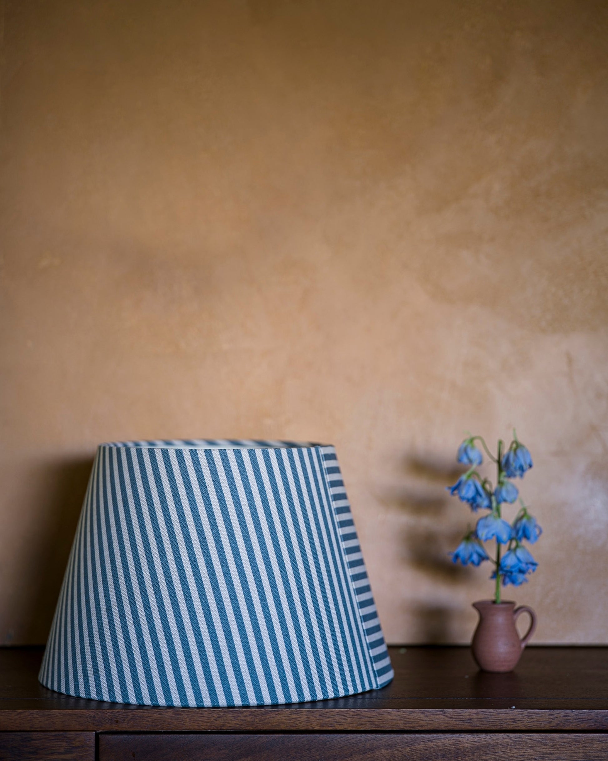Luxury empire lampshade in delphinium on drawers