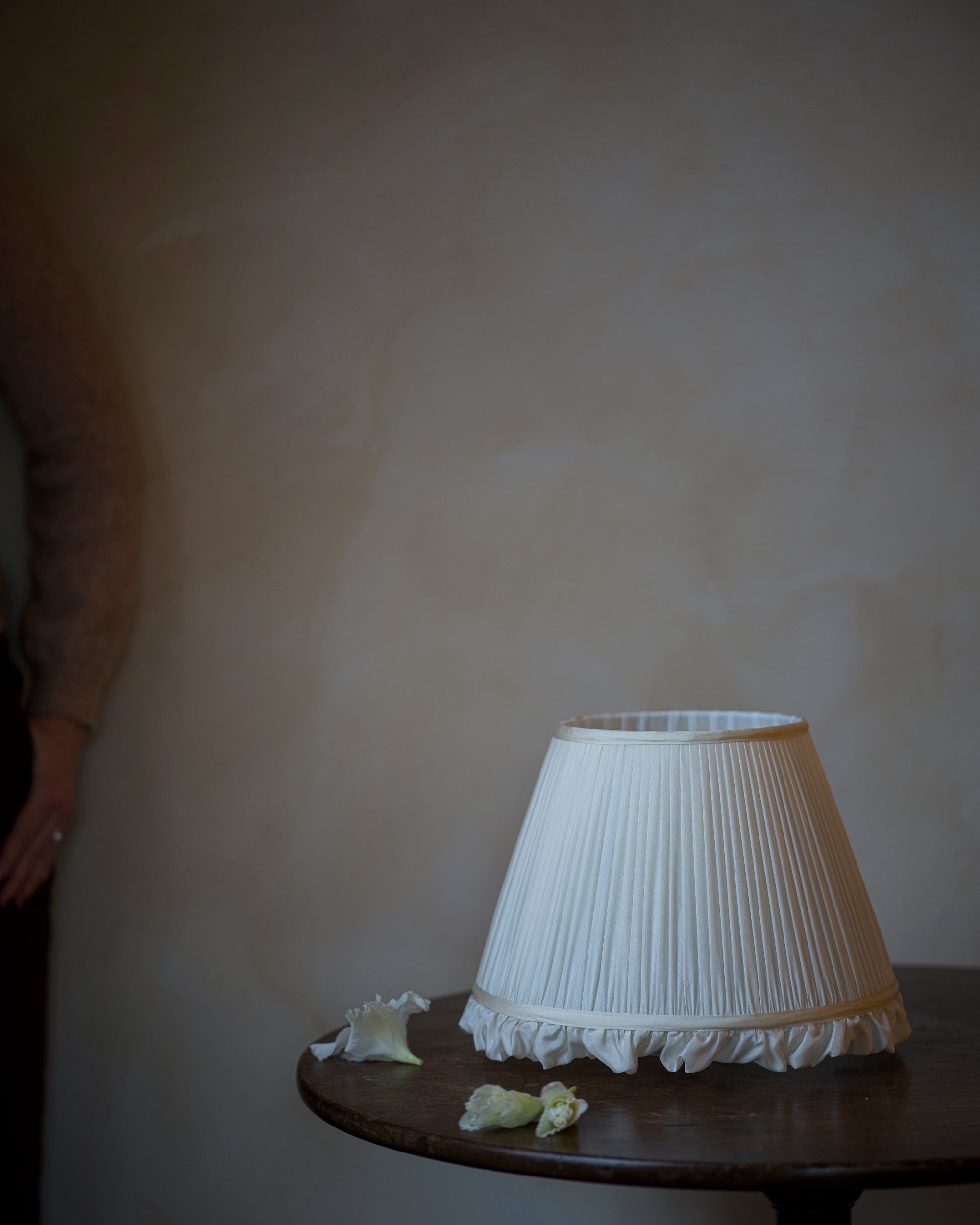 Luxury frilly lampshade in iris on table