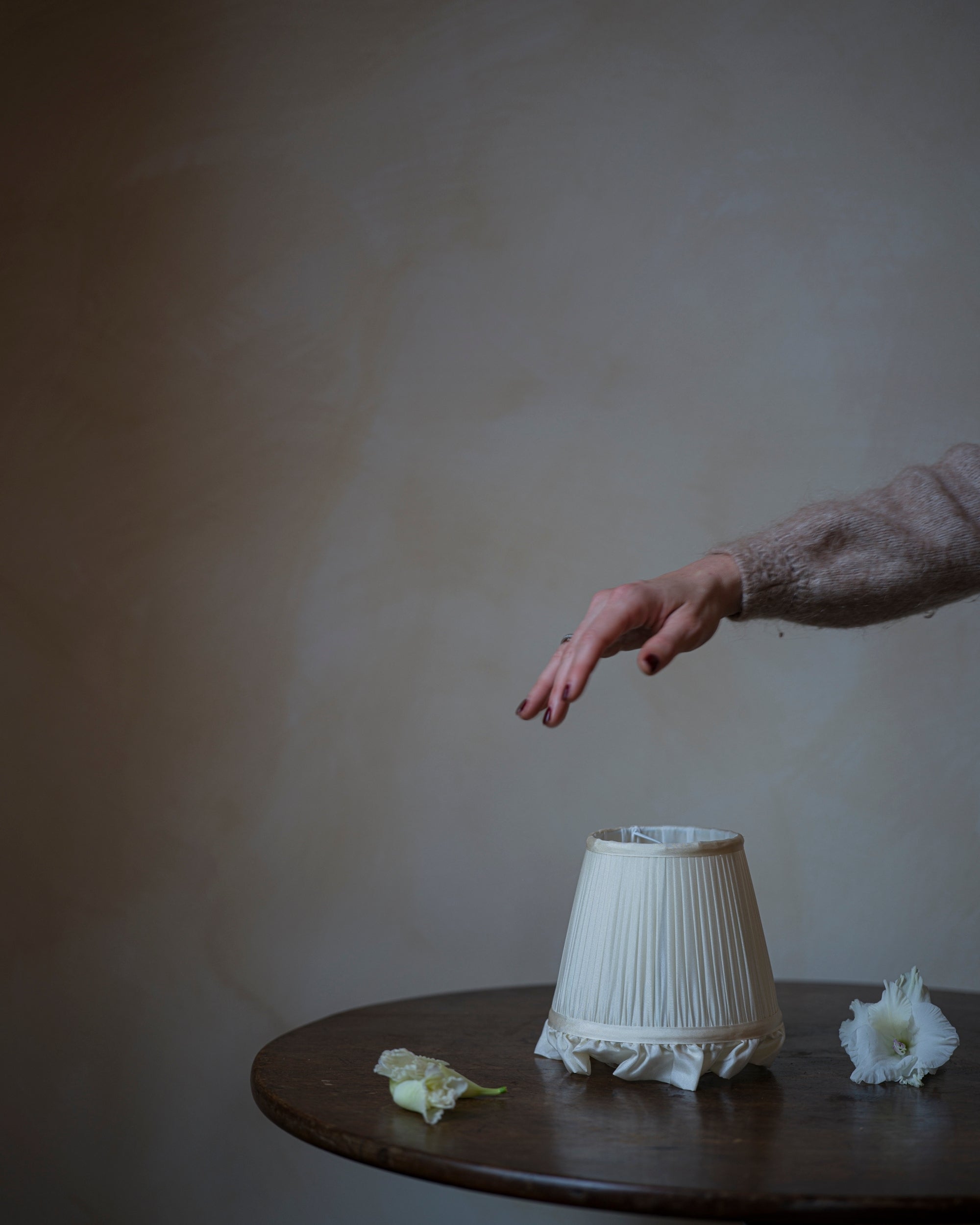 Luxury frilly lampshade in jasmine on table 